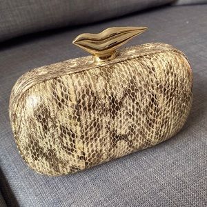 Gold tone, snake skin pattern embossed clutch bag